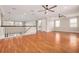 Spacious bonus room with hardwood floors and ceiling fan at 3366 Cat Brier Trl, Harmony, FL 34773