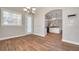 Bright dining room with hardwood floors and view into the kitchen at 3366 Cat Brier Trl, Harmony, FL 34773