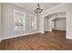 Bright dining room with hardwood floors and access to the kitchen at 3366 Cat Brier Trl, Harmony, FL 34773