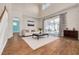 Bright living room with hardwood floors, high ceilings, and a view of the pool at 3366 Cat Brier Trl, Harmony, FL 34773