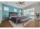 Main bedroom with plush bed, hardwood floors and sliding doors to the pool area at 3366 Cat Brier Trl, Harmony, FL 34773