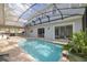 Large screened-in pool with open patio and outdoor kitchen at 3366 Cat Brier Trl, Harmony, FL 34773