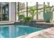 Relaxing pool area with waterfall feature at 3366 Cat Brier Trl, Harmony, FL 34773