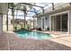 Inviting screened pool with spacious patio area at 3366 Cat Brier Trl, Harmony, FL 34773