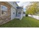 Landscaped side yard with stone and stucco exterior at 3366 Cat Brier Trl, Harmony, FL 34773