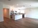 Open concept kitchen with island and stainless steel appliances at 148 Summerlin Loop, Haines City, FL 33844