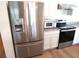 Stainless steel refrigerator, microwave, and stove at 148 Summerlin Loop, Haines City, FL 33844