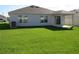 Expansive backyard with green lawn, ideal for recreation at 148 Summerlin Loop, Haines City, FL 33844