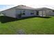 Large grassy backyard offering great outdoor space at 148 Summerlin Loop, Haines City, FL 33844