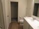 Bathroom with vanity, toilet and access to a closet at 148 Summerlin Loop, Haines City, FL 33844