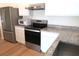 Stainless steel appliances and granite countertops in the kitchen at 148 Summerlin Loop, Haines City, FL 33844