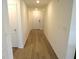 Bright hallway with light wood flooring at 148 Summerlin Loop, Haines City, FL 33844