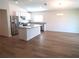 Modern kitchen with stainless steel appliances and granite countertops at 148 Summerlin Loop, Haines City, FL 33844