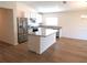 Modern kitchen with island, stainless steel appliances, and granite countertops at 148 Summerlin Loop, Haines City, FL 33844