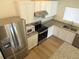 Stainless steel appliances and granite countertops in this kitchen at 148 Summerlin Loop, Haines City, FL 33844
