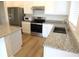 Kitchen with stainless steel appliances and granite countertops at 148 Summerlin Loop, Haines City, FL 33844