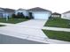 Single-story house with gray siding and white garage door at 148 Summerlin Loop, Haines City, FL 33844