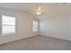 Spacious bedroom with neutral carpeting and ample natural light at 2572 Berrington Loop, The Villages, FL 32162