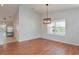Spacious dining area with hardwood floors and large window at 2572 Berrington Loop, The Villages, FL 32162