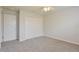 Spacious bedroom featuring wall-to-wall carpet and ample closet space at 2572 Berrington Loop, The Villages, FL 32162