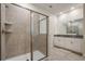 Elegant bathroom with a large shower and double vanity at 4550 Narrative Ln, Kissimmee, FL 34746