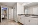 Bathroom with double vanity and gray countertop at 4550 Narrative Ln, Kissimmee, FL 34746