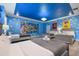 Toy Story themed bedroom with four twin beds and blue walls at 4550 Narrative Ln, Kissimmee, FL 34746