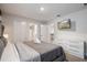 King bedroom with white dresser and TV at 4550 Narrative Ln, Kissimmee, FL 34746