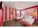 Two twin beds, princess mural, and pink accents at 4550 Narrative Ln, Kissimmee, FL 34746