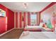 Two twin beds, princess mural, and pink decor at 4550 Narrative Ln, Kissimmee, FL 34746