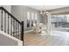 Elegant dining room with white chairs and a modern chandelier at 4550 Narrative Ln, Kissimmee, FL 34746