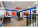 Fun game room with air hockey, arcade game, and large mural at 4550 Narrative Ln, Kissimmee, FL 34746