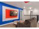 Media-equipped game room with large screen and comfortable seating at 4550 Narrative Ln, Kissimmee, FL 34746