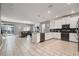 Modern kitchen with white cabinets, stainless steel appliances and an island at 4550 Narrative Ln, Kissimmee, FL 34746