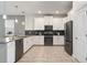 Modern kitchen with white cabinets and stainless steel appliances at 4550 Narrative Ln, Kissimmee, FL 34746