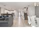 Open floor plan with living room, kitchen and dining area at 4550 Narrative Ln, Kissimmee, FL 34746