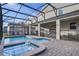 Resort-style pool and spa with covered patio and spacious deck at 4550 Narrative Ln, Kissimmee, FL 34746