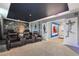 Home theater with leather seating and superhero decor at 4550 Narrative Ln, Kissimmee, FL 34746