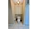 Small bathroom with toilet and overhead storage at 3234 Bonnybrook S Dr, Lakeland, FL 33811