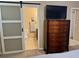 Main bathroom with toilet, sink, and barn door leading to shower at 3234 Bonnybrook S Dr, Lakeland, FL 33811