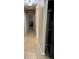 Long hallway with tile flooring and access to other rooms at 3234 Bonnybrook S Dr, Lakeland, FL 33811