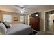 Bright bedroom with a large bed, dresser, and ensuite bathroom access at 3234 Bonnybrook S Dr, Lakeland, FL 33811