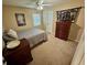 Second bedroom with double bed, dresser, and carpeted flooring at 3234 Bonnybrook S Dr, Lakeland, FL 33811