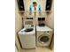 Convenient laundry room with washer and dryer, and additional shelving at 3234 Bonnybrook S Dr, Lakeland, FL 33811
