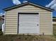 Detached garage with roll-up door and side door at 3234 Bonnybrook S Dr, Lakeland, FL 33811
