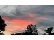 Peaceful sunset view over trees and houses at 3234 Bonnybrook S Dr, Lakeland, FL 33811