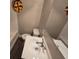 Clean bathroom with single vanity and stained glass window at 1124 Sunshine Ave, Leesburg, FL 34748
