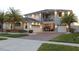 Stunning two-story home with an inviting front entrance and well-manicured lawn at 2436 Chateau Loop, Kissimmee, FL 34741