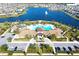 Community pool and clubhouse with lake views and ample parking at 2436 Chateau Loop, Kissimmee, FL 34741