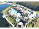 Resort-style community pool and clubhouse with expansive deck and lake views at 2436 Chateau Loop, Kissimmee, FL 34741